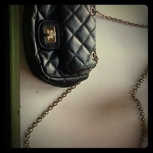 Small black hand bag with gold shoulder chain